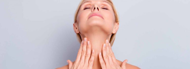 A Lady showing her neck lines | Get Radiesse Collagen Boost for Necklines at Beauty Boost Med Spa in Newport Beach, CA