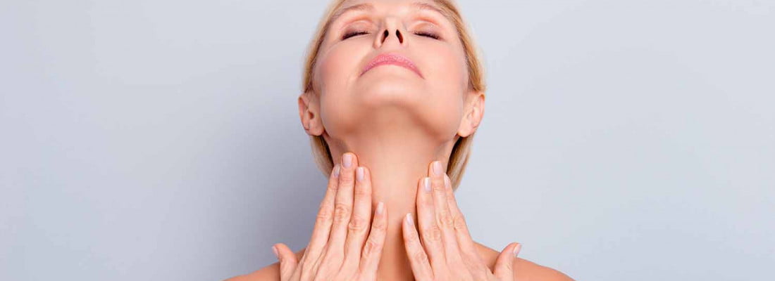 A Lady showing her neck lines | Get Radiesse Collagen Boost for Necklines at Beauty Boost Med Spa in Newport Beach, CA