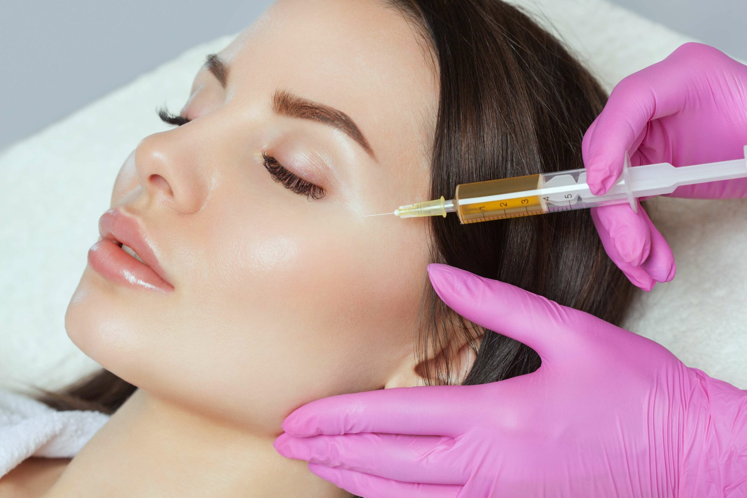 The pretty lady receiving injection near eye | Collagen Stimulators in Beauty Boost Med Spa at Newport Beach, CA