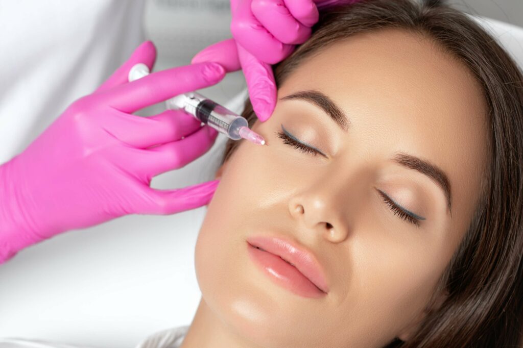 A Lady getting injection near eye | Get Botox on Beauty Boost Med Spa in Newport Beach, CA
