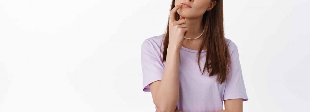 A Woman thinking about something | Get guidance on Botox vs Dysport at Beauty Boost Med Spa in Newport Beach, CA