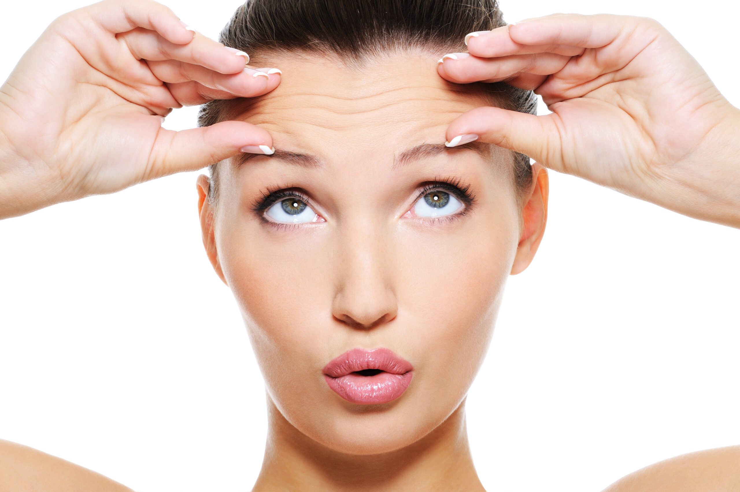 A Woman touching on wrinkles in her forehead | Get treatment for Wrinkles at Beauty Boost Med Spa in Newport Beach, CA