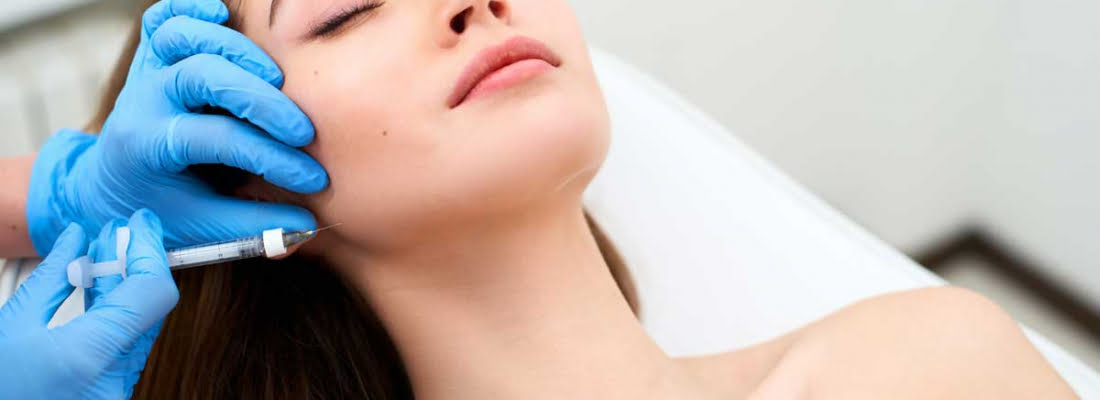 A Lady getting Injection on jawline | Know About Masseter Reductions in Beauty Boost Med Spa at Newport Beach, CA