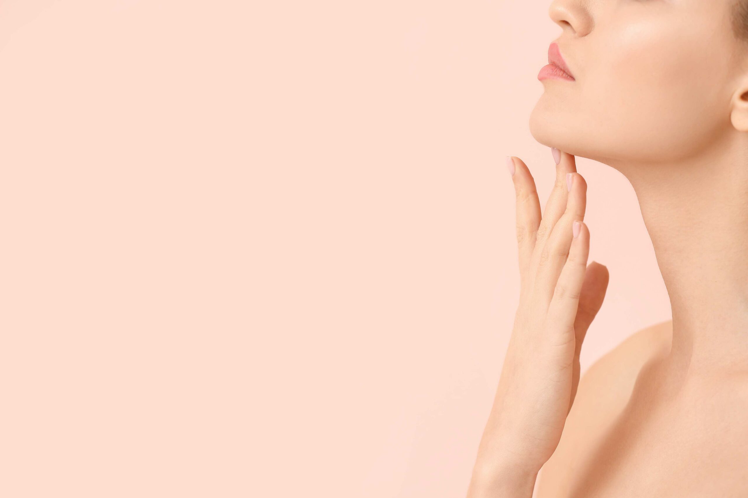 A Woman holding her hands near neck | Get Kybella in Beauty Boost Med Spa at Newport Beach, CA